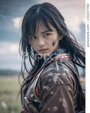 A young female samurai in armor fighting on a rainy Sengoku period battlefield 130207760