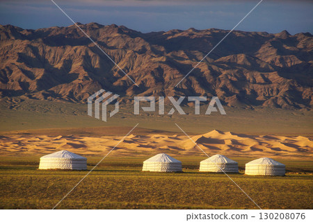 Traditional Yurts Positioned Harmony with the Majestic Mountains Nearby Traditional Yurts Positioned Harmony with the Majestic Mountains Nearby 130208076