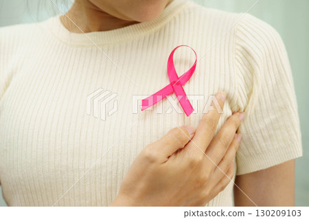 Asian woman with pink ribbon for October world breast cancer day. 130209103