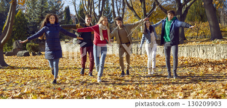 Group of friends having fun on nature in autumn season 130209903