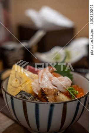 Kaisen Don, a Japanese rice bowl dish of seafood. Including raw fish such as Salmon, Saba, Engawa, Foie gras, Ikura. 130210841