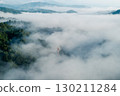 Morning mist in the forest and mountains 130211284