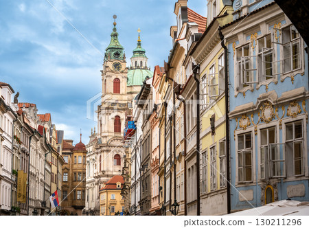 Prague, Czech Republic, August 6, 2023. Breathtaking view, on a beautiful summer day, from Charles Bridge towards the Lesser Town district. The colorful facades stand out. Iconic views of the city. Prague, Czech Republic, August 6, 2023. Breathtaking view, on a beautiful summer day, from Charles Bridge towards the Lesser Town district. The colorful facades stand out. Iconic views of the city. 130211296