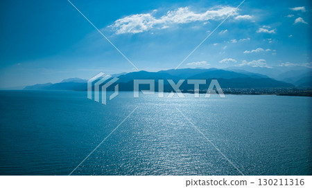 Offshore wind turbines and the Kurobe River alluvial fan at Shimoniikawa Coast in Toyama Prefecture at the end of August Offshore wind turbines and the Kurobe River alluvial fan at Shimoniikawa Coast in Toyama Prefecture at the end of August 130211316