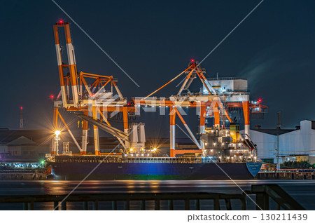 Large crane and cargo ship night view Large crane and cargo ship night view 130211439