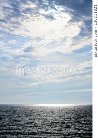 Light reflected on the sea at dusk and summer clouds 130211821
