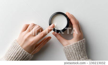 woman hands holding a paper ball in light teal warm c woman hands holding a paper ball in light teal warm c 130213032
