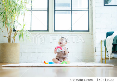 Baby playing with building blocks 130214088