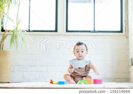 Baby playing with building blocks 130214089