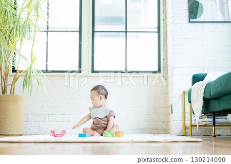 Baby playing with building blocks 130214090