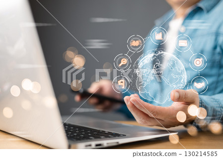 A businessman interacts with a futuristic digital market plan AI management interface, featuring a glowing holographic globe with interconnected analytics icons, symbolizing innovation and strategy. A businessman interacts with a futuristic digital market plan AI management interface, featuring a glowing holographic globe with interconnected analytics icons, symbolizing innovation and strategy. 130214585