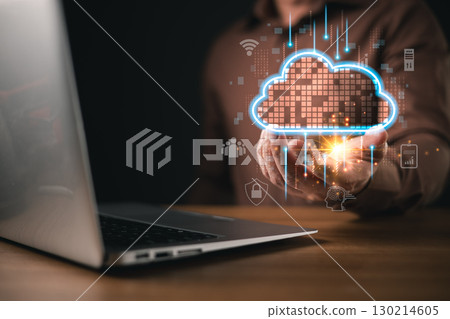 A person holds a glowing digital cloud above a wooden desk with a computer nearby, symbolizing solution concepts like backup and consistency through data storage, security, and connectivity. A person holds a glowing digital cloud above a wooden desk with a computer nearby, symbolizing solution concepts like backup and consistency through data storage, security, and connectivity. 130214605