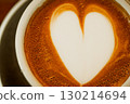 Cups of coffee decorated with a heart 130214694