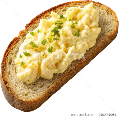 Creamy scrambled eggs with fresh parsley garnish served on a slice of rustic toasted bread 130215065