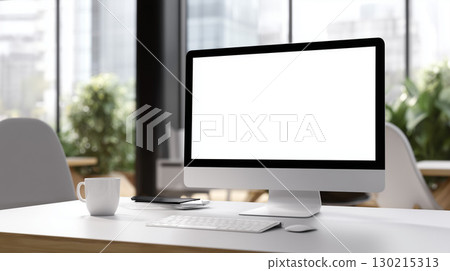 Bright desk view in a modern office with monitors 130215313