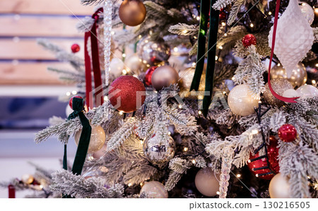 Christmas tree branches with a garland Christmas tree branches with a garland 130216505