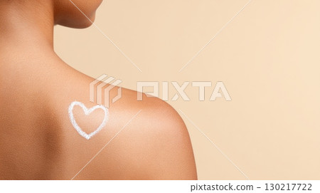 Heart drawn with sunscreen on female shoulder Heart drawn with sunscreen on female shoulder 130217722