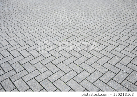 Gray structural stone wall of the ancient building consists of bricks. Nature structural background. Gray structural stone wall of the ancient building consists of bricks. Nature structural background. 130218168