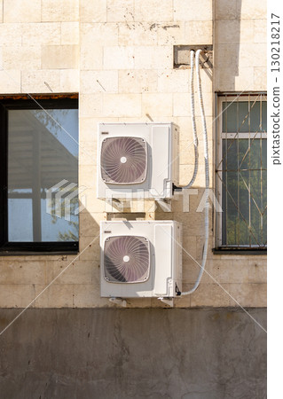 air conditioners are mounted on the wall. technologies for air cooling in hot weather. air conditioners are mounted on the wall. technologies for air cooling in hot weather. 130218217