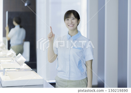 Portrait of a young female office building cleaner. Photo courtesy of Tokyo Electronics College, Denpa Gakuen Corporation. 130219890