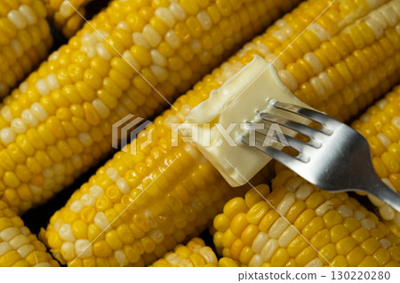 Butter Melting Over Hot Cooked Corn Cobs Closeup. Butter Melting Over Hot Cooked Corn Cobs Closeup. 130220280