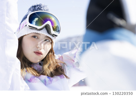 Cute woman enjoying the snowy mountains 130220350