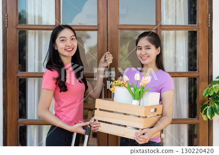 Happy couple moving into a new home, celebrating love and new beginnings Happy couple moving into a new home, celebrating love and new beginnings 130220420