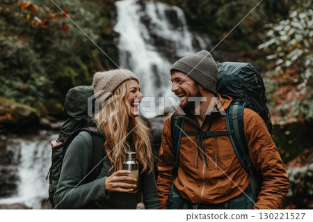 Adventure enthusiasts laughing by a waterfall nature retreat photography outdoor candid moments 130221527