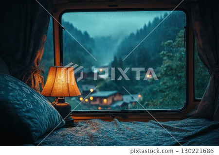 Cozy evening view from a camper mountain village photography rainy setting intimate perspective tranquil atmosphere 130221686