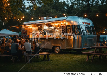 Food truck gathering outdoor dining experience urban park evening atmosphere community vibes 130221825