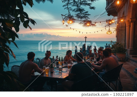 Sunset dining experience with friends beachside restaurant outdoor gathering tropical evening relaxed atmosphere 130221897