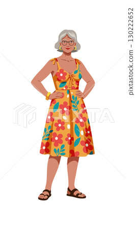 Older woman wearing floral dress with bright colors and sandals standing confidently Older woman wearing floral dress with bright colors and sandals standing confidently 130222652