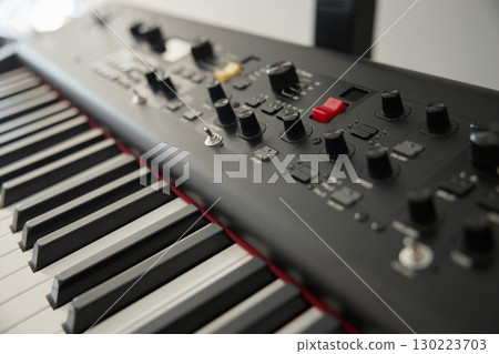 Professional keyboard synthesizer featuring a range of versatile controls for performance 130223703