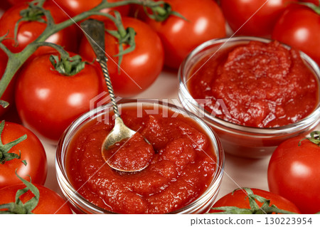 Concentrated Tomato Paste in Mini Sauce Dishes. Natural Culinary Detail Concentrated Tomato Paste in Mini Sauce Dishes. Natural Culinary Detail 130223954