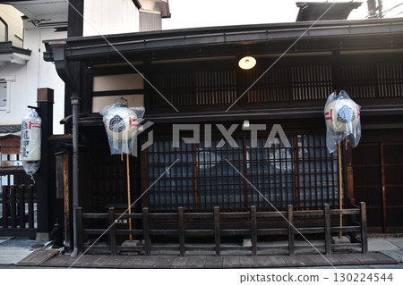 Old townscape of Takayama City, Gifu Prefecture, Japan. Historic old houses and decorative lanterns. Morning scene during the Takayama Spring Festival. 130224544