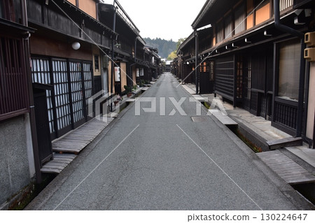 Old townscape of Takayama City, Gifu Prefecture, Japan. Old houses exuding a sense of history. Morning scene during the Takayama Spring Festival. Old townscape of Takayama City, Gifu Prefecture, Japan. Old houses exuding a sense of history. Morning scene during the Takayama Spring Festival. 130224647
