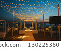 Beachfront Pathway with Twinkling String Lights at Sunset 130225380