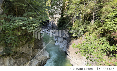 Serene Natural Canyon with Flowing River 130225387