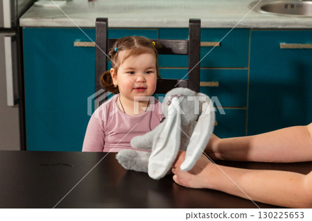 Warm interaction between woman and small child during learning play at home. Concept of early development, preschool skills, and nurturing relationships 130225653