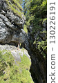 Hiker Exploring Stunning Rocky Canyon Path 130226191