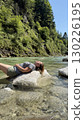 Relaxing by the River on a Sunny Day in Nature 130226195