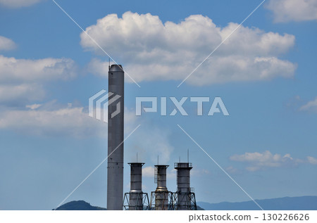 A cute white cloud and chimney floating in the blue sky A cute white cloud and chimney floating in the blue sky 130226626