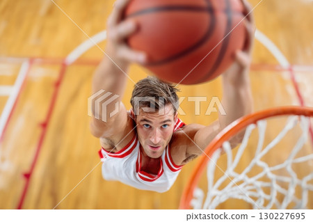 Burning candle surrounded by cempasuchil and other flowers creating a Dia de Muertos offering Burning candle surrounded by cempasuchil and other flowers creating a Dia de Muertos offering 130227695