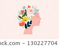 Woman profile with blooming flowers growing from her head 130227704