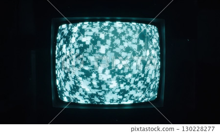 Old analog television showing abstract pixelated noise pattern 130228277