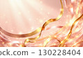 Golden and pink ribbons flowing on sparkling background 130228404
