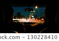 Two men driving car on highway at night 130228410