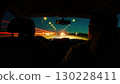 Drivers traveling at night on illuminated road 130228411