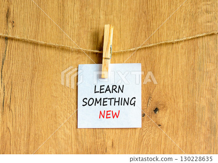 Learn something new symbol. Concept words Learn something new on beautiful white paper on clothespin. Beautiful wooden background. Business motivational learn something new concept. Copy space. Learn something new symbol. Concept words Learn something new on beautiful white paper on clothespin. Beautiful wooden background. Business motivational learn something new concept. Copy space. 130228635