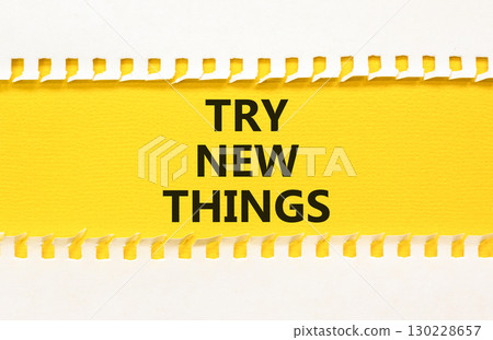 Try new things symbol. Concept words Try new things on beautiful yellow paper on clothespin. Beautiful white paper background. Business motivational lifestyle try new things concept. Copy space. 130228657